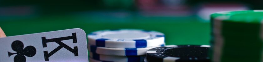 white and black dice on green table